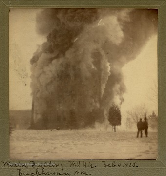 Spectators watch as the main building of the Seminary is destroyed by fire.