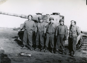 This photograph was included in West Virginia University student, Louis Piccalo's narrative documenting his military experience during World War II. The soldiers are not identified, however they could possibly be in Piccalo's outfit, the 17th Cavalry Reconnaissance Squadron, 83rd Infantry.