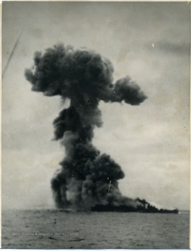 This photograph was included in West Virginia University student Stanley Stevens' narrative documenting his military experiences during World War II. After the USS Princeton took a direct hit from a Japanese Bomber, the USS Birmingham can along side to help fight the fires. The Princeton's bomb magazine blew up killing 200 men on the Birmingham. 