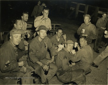 The unidentified men shown here relaxing, were part of Cecil Teets' outfit which served in the Pacific Theater.
