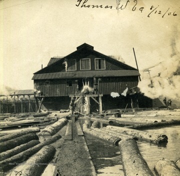 Postcard photograph of the Rumwood Sawmill in Thomas, West Virginia, labeled as "the largest in the state". See the original for correspondence on the front.