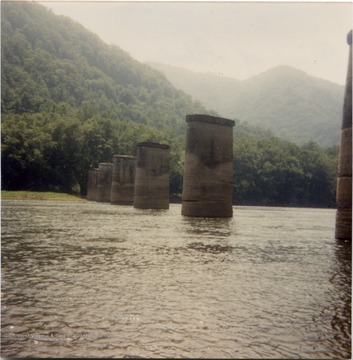 The piers were part of the a 750-foot railroad bridge spanning the New River near the mouth of Glade Creek. The line was operated by the Glade Creek Coal and Lumber Railway, 1924-1929 and Babcock Coal &amp; Timber Company, 1929-1936 . The bridge was salvage by the Chesapeake and Ohio Railroad during World War II.