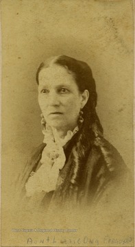 A carte de visite of a woman with long curls and "ear bobs" or earrings.