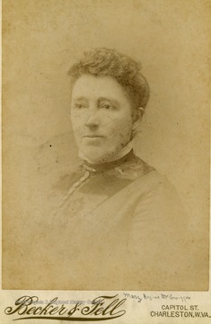A cabinet card portrait of a middle age woman.