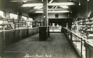 Unidentified employees stand behind the counters in the company store at Mine Number 4 near Beckley, West Virginia.