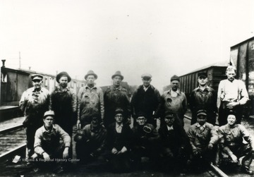 Workers L to R: Maynord A. Oliver, Tom Myrtle, Evert Richmond, Everette E. Harvey, O. T. McGuffin, V. T. (Vernie) Boley, J. W. McClure, Bill Coop, "Gumbo" Morris (car foreman), Arthur Meeks, Mr. Roles, and Mr. Downey.
