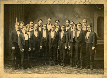 Members identified: Roy Marcum, Clyde Watson, Septimus Kell, Leon Spragg, Earle Townshend, Tom Foulk, Wayne Miller, Earle Reiley, Chesney Ramage, John Keely, Ross Spence, Clyde Carney, Arthur Arnold, Arthur Post, Paul Mahone. After graduating from WVU, Chesney Ramage attend Johns Hopkins Medical School and served as superintendent and chief surgeon of the Miners' Hospital in Fairmont.