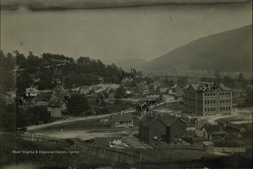 Photograph post card of Norton, southwest of the West Virginia state line. Several buildings and homes are identified. 