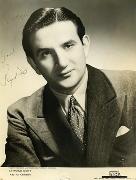 This photo was collected by George and Mike Barrick, two WVU students. Raymond Scott and his orchestra performed at the Warner Theater in Morgantown West Virginia. The photo is made out "To George Raymond Scott" 