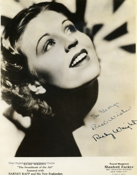 This is a photo of Ruby Wright. She performed at the Met. in Morgantown, West Virginia. She was known as "The Sweetheart of the Air" and was featured with Barney Rapp and the New Englanders. The photo was collected by WVU students George and Mike Barrick. It is signed "To George Best Wishes Ruby Wright". 