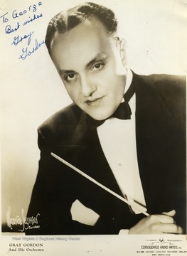 This is a photo of Gray Gordon collected by WVU students George and Mike Barrick. He performed at the Warner Theater in Morgantown, West Virginia. It is signed "To George Best Wishes Gray Gordon". 