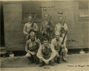 Inscribed on the photo are the men's nicknames. The top row from left to right: "Cocky" Roach, (Prisoner of War) P.W., "Hoppy". The bottom row from left to right: Dotson, Pless, Cpl. Ard. The man, back row center is George Barrick Jr. from Morgantown and a WVU student before and after the war. Barrick fought in the Battle of the Bugle and survived. He subsequently earn the rank of 2nd Lieutenant after training in the ROTC program, 1947-1949, at West Virginia University and was killed in the Korean War in 1950. 