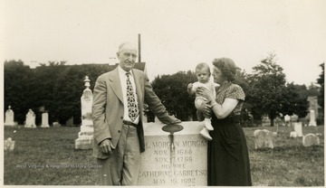 Col. Morgan Morgan made the first settlement in West Virginia, in 1726. In the photo from left to right: Max Mathers, George M. Barrick III and Anna Mathers. the baby is the Mathers great-grandson. The Mathers/Barrick family were descendents of Col. Morgan Morgan. 