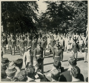 General Dwight D. Eisenhower passes in review of the West Virginia University ROTC units, on campus.
