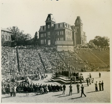 General Dwight D. Eisenhower addressed the students and faculty at West Virginia University during a special convocation at Mountaineer Field. The building in the background is Woodburn Hall.