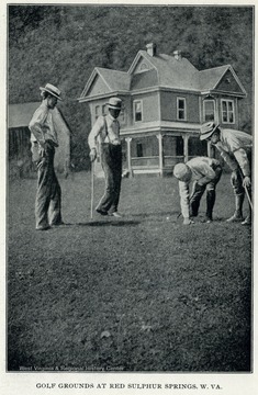 Four unidentified well-dressed gentlemen playing golf on the golf ground, and one of them is checking on the ground. The image is from the pamphlet, "Red Sulphur Springs, Monroe County, W. Va.", 1918.