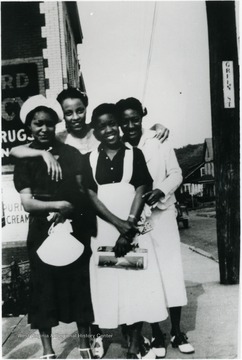 From left to right: Unidentified female, Naomi Butler, Edna Cranford, and Naomi Dixon. Information on p. 147 in "Our Monongalia" by Connie Park Rice. Information with the photograph includes "Courtesy of Bobbie Drew Ward". 