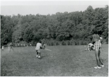 Camp Muffly was a 4-H site in Monongalia County. Segregated black and white members attended Camp Muffly in Clinton District at different times. All persons in the photo are unidentified. Information on p. 138,139,140 in "Our Monongalia" by Connie Park Rice. Information with the photograph includes "Courtesy of Ivry Moore Williams."   
