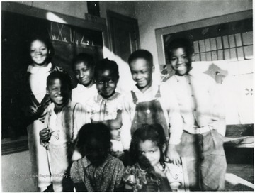 Group of students at Pursglove School in Monongalia County. All persons in the photo are unidentified. Information on p. 119 in "Our Monongalia" by Connie Park Rice. Information with the photograph includes "Courtesy of Kitty Hughes."   
