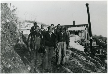 School children on their way to or from school. The two boys front and right are Robert Lucas and Norris Finney, others are not identified. The Dallas Hall Shack is in the background. Information on p. 121 in "Our Monongalia" by Connie Park Rice. Information with the photograph includes "Courtesy of Kitty Hughes."   