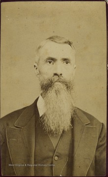 An older man with a long, grey beard.