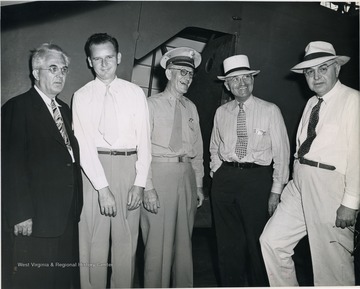 Senator Harry Truman (Missouri), second from the right,and Senator H. W. Kilgore (West Virginia)far right, visit Fort Worth, Texas. All other men are unidentified. 