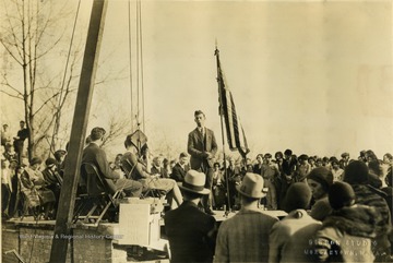 Stanley Ponek is standing, all other persons are unidentified. 