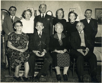Information Included with photograph: "Pictured are: Buster, Mae, Cecil, Lara, Eva, Elva, Essie, J. S. Simms, Sallie Simms, Jesse. Not pictured: Lee and Marshall". 