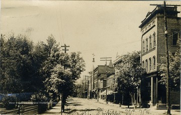 Post card photograph of unpaved Main Street in Philippi, West Virginia. 