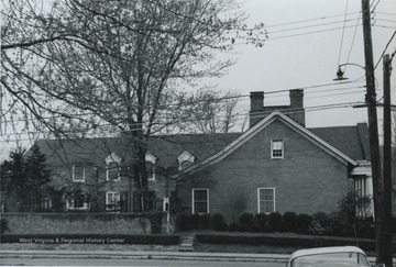 East side,facing Wagner Road (note the paired chimney). Information found on page 58 in "The influences of Nineteenth Century Architectural Styles on Morgantown Homes" by Clyda Paire Petitte. It is Figure 42.