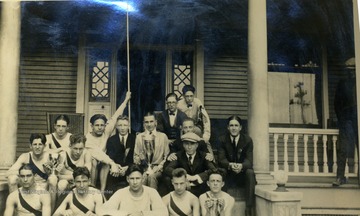 Bottom row L to R: "Judy" Murrin, Harry Shafer Barnum, Unidentified, M. Beren. Second row L to R: Harold Murrin, Bill Crow, Coach Thomas. Third row L to R: Sam Hamrick, "Gib" Welch Beaty, B. Shore, Hannaman Roberts. Page number 100.