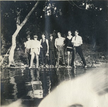 Inscription with the photograph, from left to right: "Stew, Brun, Salty, Fitz, Charlie, Don, Skillet". Page number 144. 