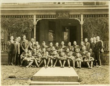 Two of the students identified are Ray (Dusty) Ash, front row-first,left and James (Jim) Guiher, front row-third left. Information included on the photograph includes ". . . several [are] Clarksburg men. . ."