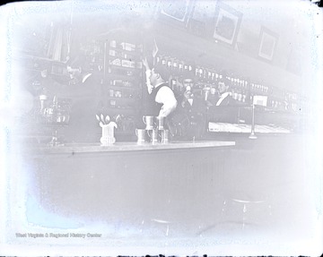 Four unidentified men, one a soda jerk, stand behind the counter at Rose's.