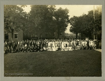 Group portrait of unidentified students and staff, located in Gilmer County.