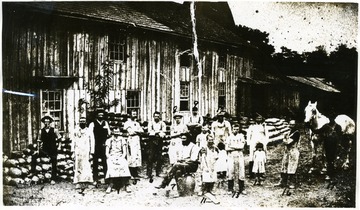 Identified L to R: 1.Billy Sprague; 2.John Morrison; 3.Walter Donnaghho (son of original owner); 4.Grant Layman; 5. Dan Mercer; 6.Will Taylor; 7.Morgan Rader; 8.Charles Gruber; 9.Ed Awls; 10.Cooper Heaton; 11.Charles Graham; 12.John Bartlett; 13.Unidentified; 14.Captain Hoar; 15.Nina Hoar(Haymond); 16.Tony Graham; 17.Tony Lotterbury; 18. Horse named Charlie                                 