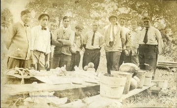 Engineering crew for construction on the Harrisville & Cornwallis Railroad. Identified L to R: Doc Flesher, Russell Fox, Ben Ayers, Perry Smith, Guy Latimer, Jamie, Ray Latimer, "Fuzzy" Fidler, Bert Adams, Harry S. Laird.