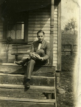 William Blair Summers sits on a porch in Morgantown W.Va.