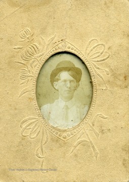 Young Charlie Summers wearing a bowler hat.