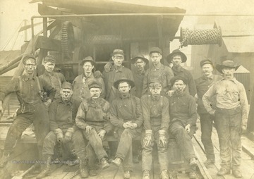 Front row, left to right:  John Davis (standing), Kay "Boots" Stevens, Jake Hayhurst, Ellie Propst, Harry "Hike" Smith, Fred Ball, and Frank Deem.  Second row, standing, left to right:  Mont Smith, Walter Eli Smith, Bill Durst (photo taken before he lost his arm in an accident at the factory), John Harris, Wes Propst, Wait Ball, and Frankie Smith.