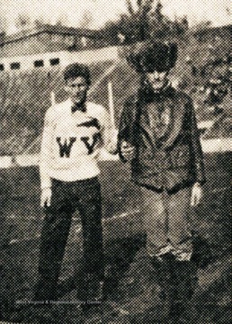 Clay Crouse, the first Mountaineer mascot at WVU, stands with an unidentified cheerleader.