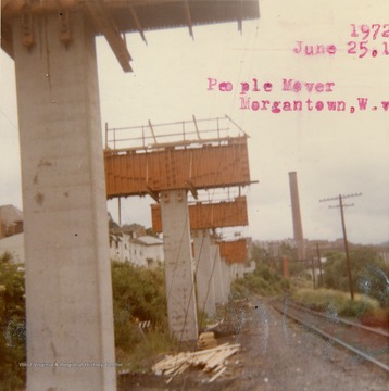 Construction of PRT tracks on a section along railroad tracks next to the Monongahela River. The PRT was also known as "The People Mover".