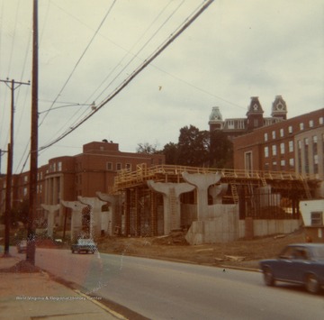 Looking at the construction of the Beechurst PRT station from across Beechurst Ave. Armstrong Hall in the background and and Woodburn Hall in the far distance.The PRT was also known as "The People Mover".