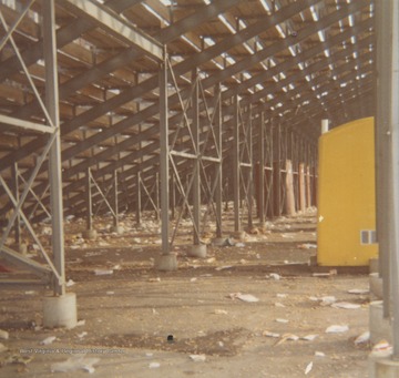 Toilets underneath stands at "Old Mountaineer Field". Yellow for women and red for men.