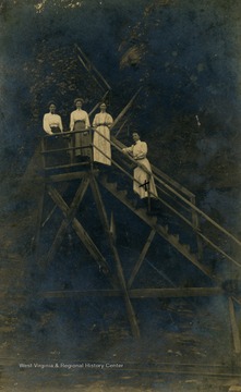 Ettice Pepper (far right) on stairs at Webster Springs, W. Va.