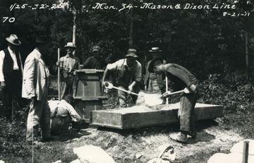 Tri-state corner of Pennsylvania, West Virginia, and Maryland at meeting of Mason-Dixon line (East and West) and Deakins Line (North and South). This is Marker #34, the last monument and the northern-most point on the Deakins line. Far left side: Samuel Garnett (U.S. geological surveyer).