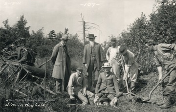 Workers in and around the hole at a site of a new marker. Far left side: William McCulloh Brown (Maryland commissioner).