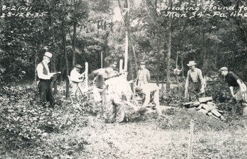 Workers dig the hole for new site of boundary marker along north-south boundary of West Virginia and Maryland. Far left: Samuel Garnett, U.S. geological surveyer looks on. As does William McCulloh Brown, Maryland commissioner (back middle).