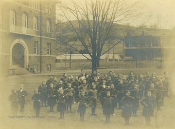 Prep school girls gym class in front of Chitwood Hall at West Virginia University.