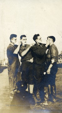 Members of the 80th Division U.S. Army give each other a shave while at basic training at Camp Lee, Virginia.
